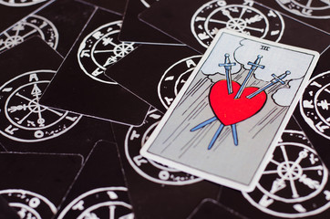 The Tarot - Card of Heart and Swords On Black Background.