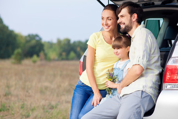 Beautiful friendly family is making journey by vehicle