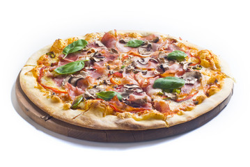 Pizza capricciosa with ham and mushrooms on white background