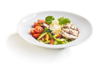 Salad with grilled chicken and vegetables on white background