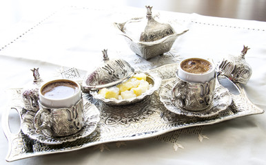 Turkish coffee with delight and traditional silver serving set