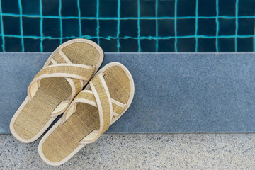 slippers beside swimming pool