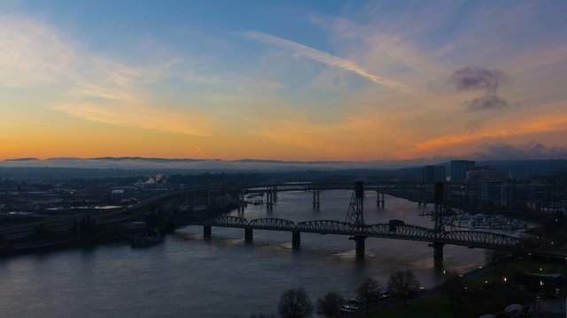 Ultra High Definition 4k Time Lapse Movie of Colorful Sunrise and Traffic Over Downtown City of Portland Oregon with Bridges across Willamette River One Early Morning 4096x2304