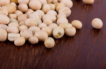 Fototapeta na wymiar Soybean on wooden background