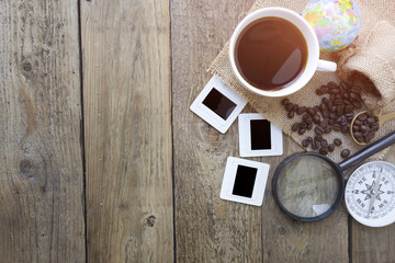 travel planning on wooden background with sun light
