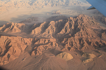 view from the airplane desert mountains