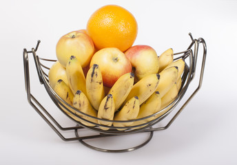 Fruit in a metal basket of fruit  .