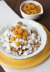 Cottage cheese with cloudberries and cereal flakes  .
