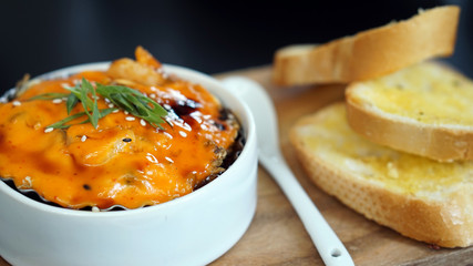 spicy scallop with mayo cream together with garlic bread.