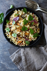 bulgur with mussels in pan