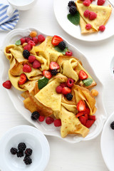 crepes with fresh berries and honey