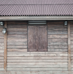 Window on the vintage wooden wall