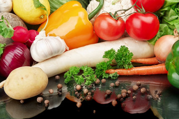 Group of different vegetables on black background