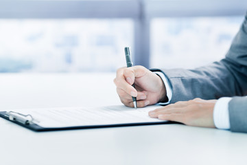 Business man signing a contract