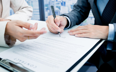 Business man signing a contract