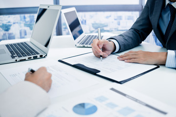 Business people discussing the charts and graphs showing the res