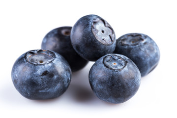 Fresh blueberries in wooden spoon