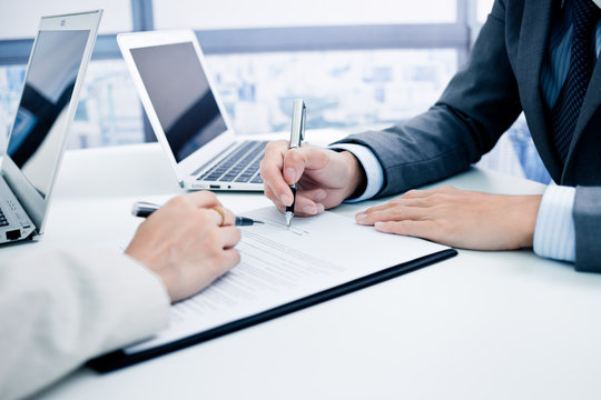 Business man signing a contract