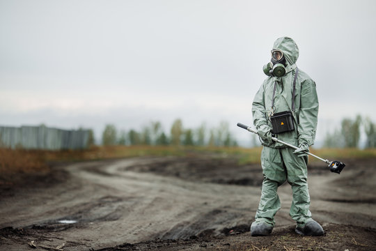 Scientist (radiation supervisor) in protective clothing and gas