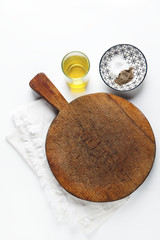 Chopping cutting board on white with seasoning