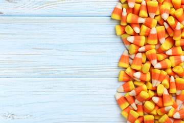 Halloween candy corns on blue wooden background