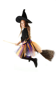 Beautiful girl witch with a broom on a white background