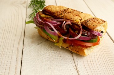 sandwiches with salad, onion, salami, pepperoni, ham, cheese and