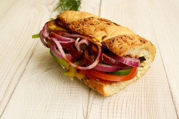 sandwiches with salad, onion, salami, pepperoni, ham, cheese and