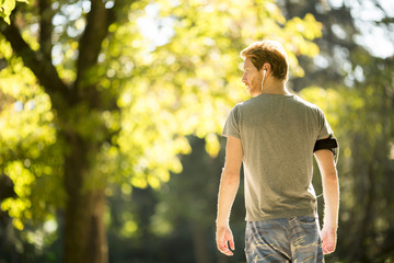 Fototapeta premium Young man at the autumn park