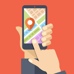 Hand holds smartphone with city map gps navigator on smartphone screen