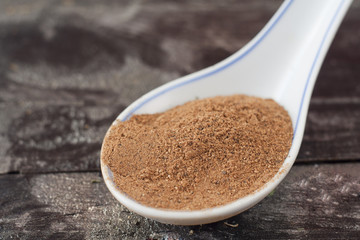 dried cinnamon on a spoon