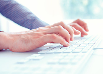 Fototapeta na wymiar Male hands or men office worker typing on the keyboard
