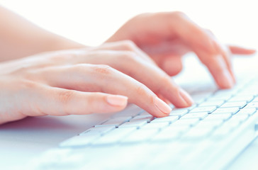 Female hands or woman office worker typing on the keyboard