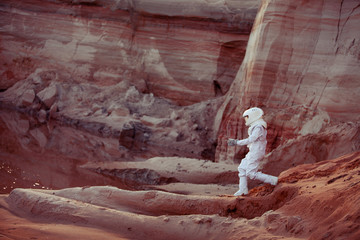 Water on Mars, futuristic astronaut, image with the effect of © Ulia Koltyrina