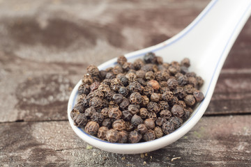 black pepper on spoon