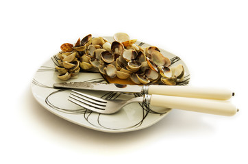 Empty dish of clams and cockles shellfish