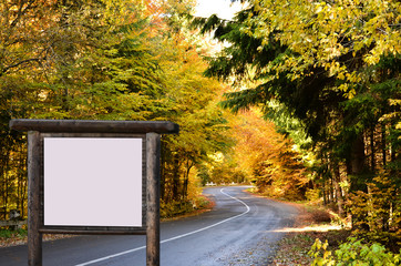 Advertising panel on the road in autumn season