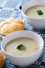 champignon soup in white bowl