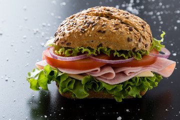 ham sandwich with brown bun