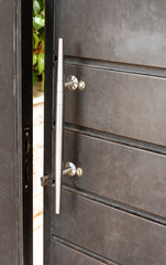 gray door with metal handle