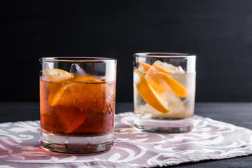 Old fashioned cocktails on the wooden background