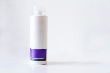 Cosmetics white purple plastic bottle beauty cream tube isolated