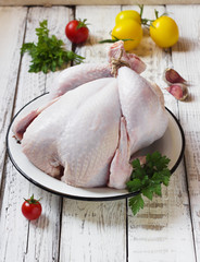 Chicken on a white wooden background © oksanka8306