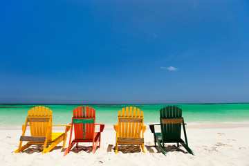 Colorful chairs on Caribbean beach