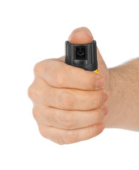 Hand with bottle of pepper spray