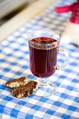 homemade cherry compote in a glass with berries