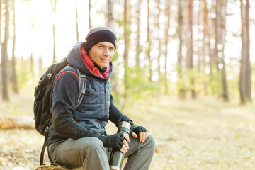 man hiking in a forest