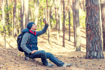 man hiking in a forest