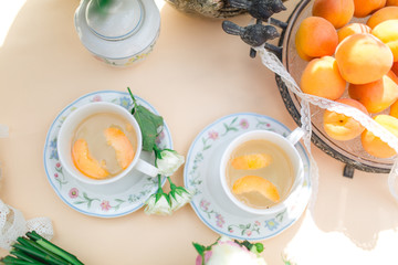 beautiful fresh cold peach tea with ripe peaches