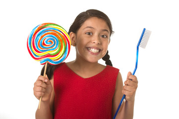 cute female child holding big spiral lollipop candy and huge too
